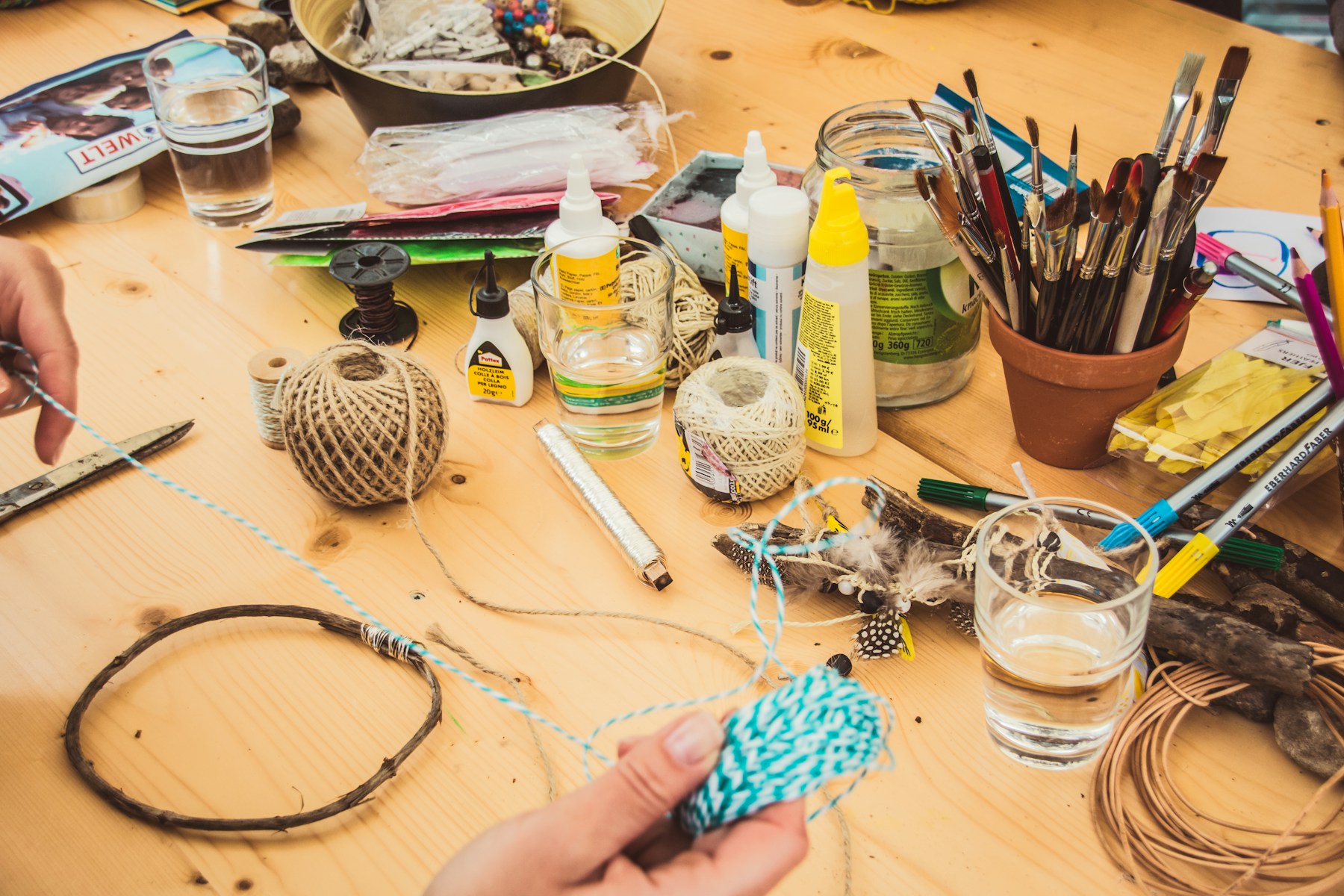 Hands working with craft thread